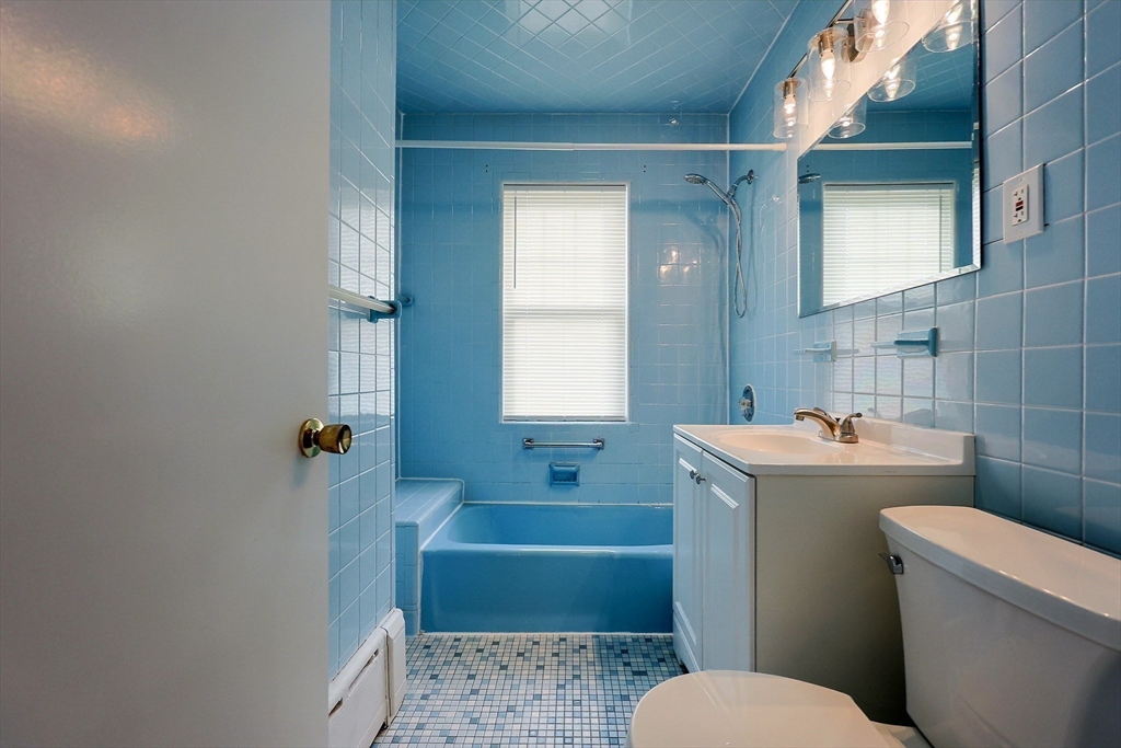 33 Woodleigh Road, Unit 2 Watertown, MA 02472 - Photo 15 of 23 a bathroom with a sink toilet and shower