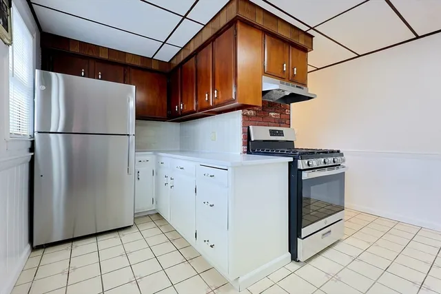 a kitchen with appliances cabinets and a sink