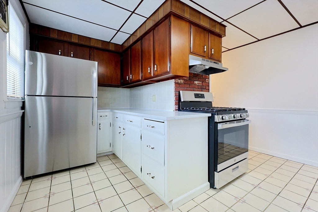 33 Woodleigh Road, Unit 2 Watertown, MA 02472 - Photo 16 of 23 a kitchen with appliances cabinets and a sink