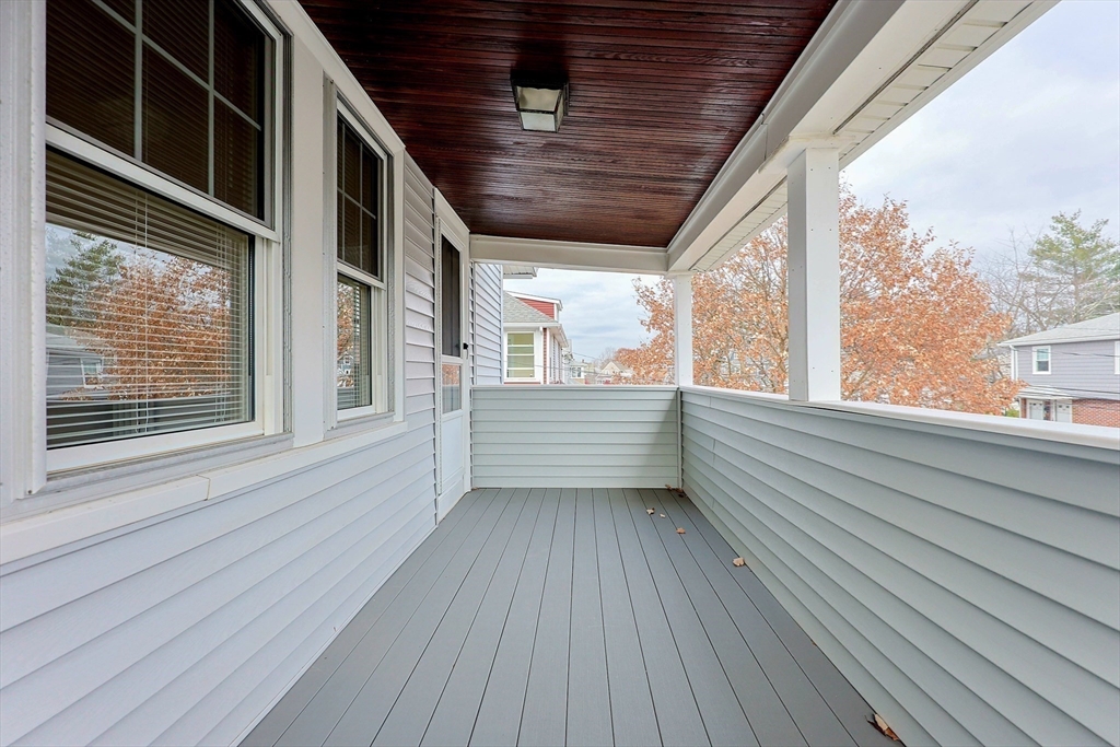 33 Woodleigh Road, Unit 2 Watertown, MA 02472 - Photo 20 of 23 a view of an empty room with wooden floor and a window