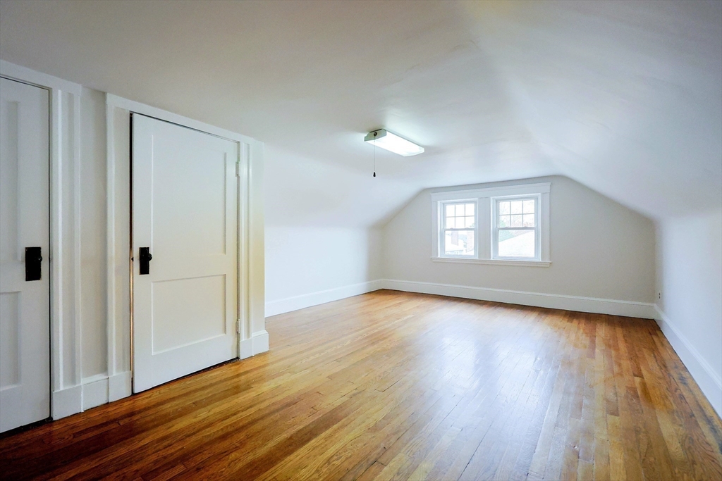 33 Woodleigh Road, Unit 2 Watertown, MA 02472 - Photo 22 of 23 a view of an empty room with wooden floor and a window