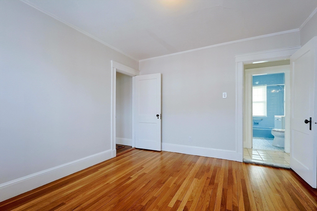 33 Woodleigh Road, Unit 2 Watertown, MA 02472 - Photo 9 of 23 wooden floor in an empty room