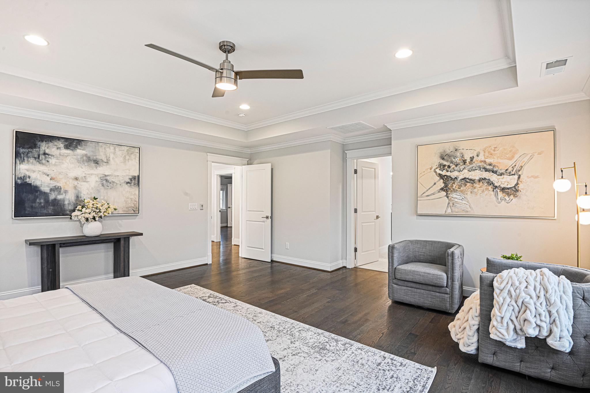 6447 Tucker Avenue McLean, VA 22101 - Photo 18 of 47 a spacious bedroom with a bed and a couch