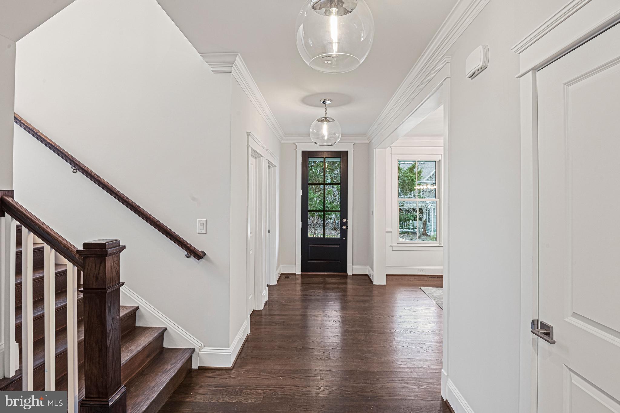 6447 Tucker Avenue McLean, VA 22101 - Photo 3 of 47 a view of an entryway with wooden floor and stairs