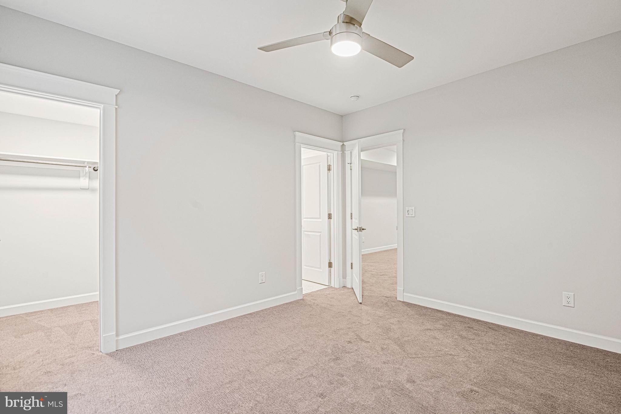 6447 Tucker Avenue McLean, VA 22101 - Photo 34 of 47 an empty room with a ceiling fan and a window