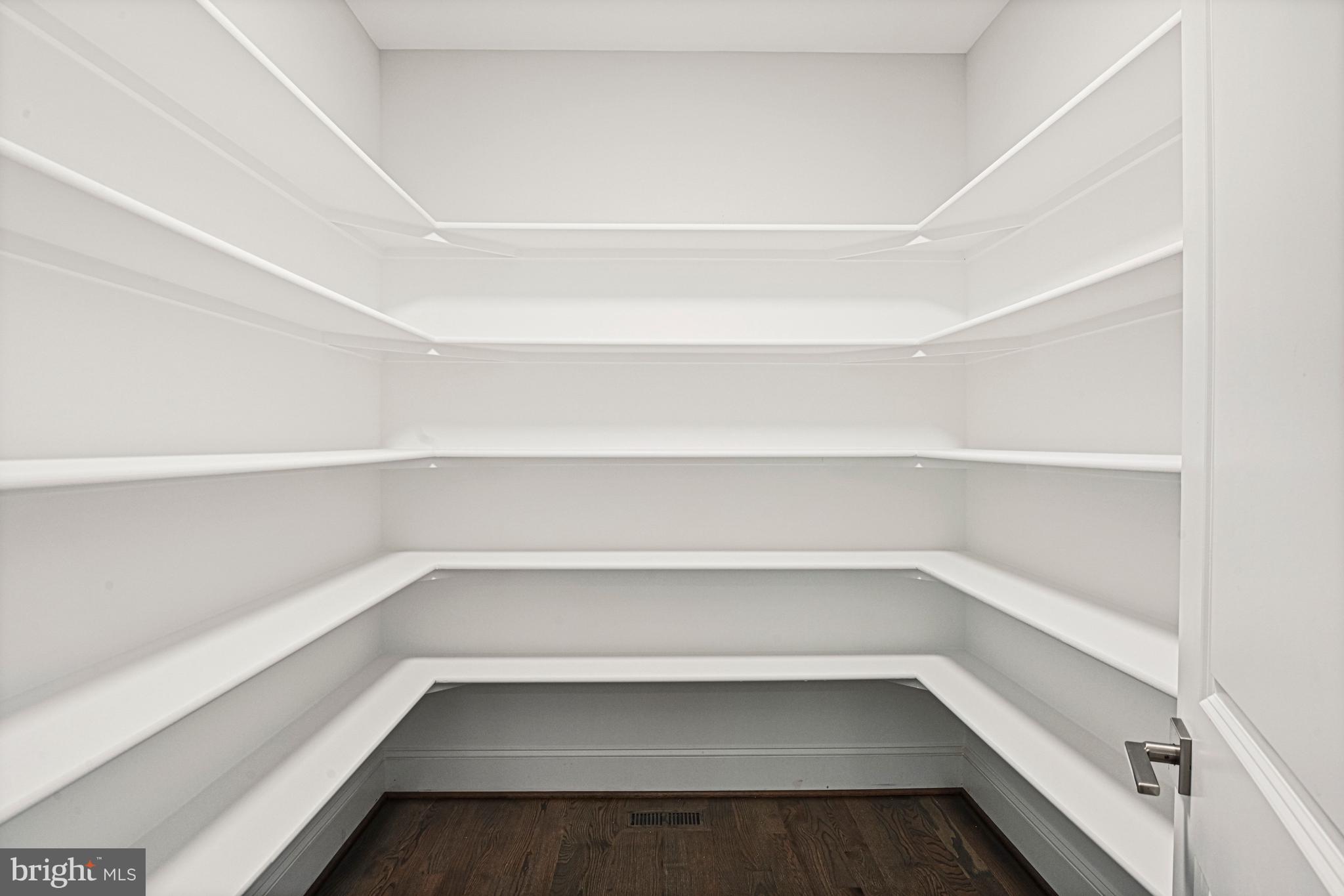 6447 Tucker Avenue McLean, VA 22101 - Photo 7 of 47 a storage room with empty racks