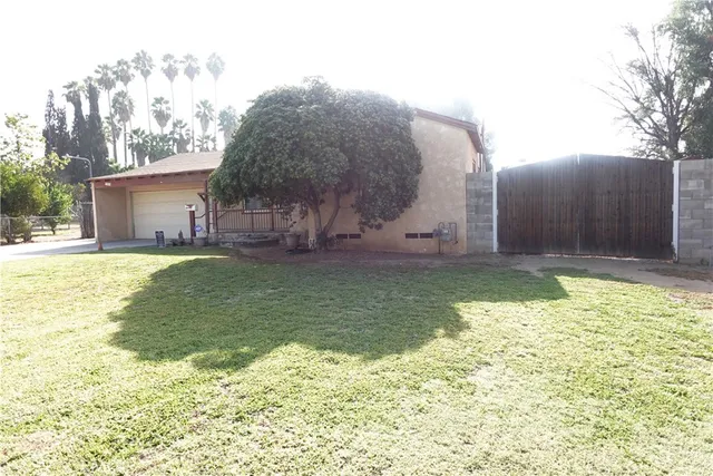 a backyard of a house with lots of green space