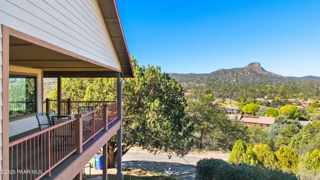 a view of a chairs and table in the balcony