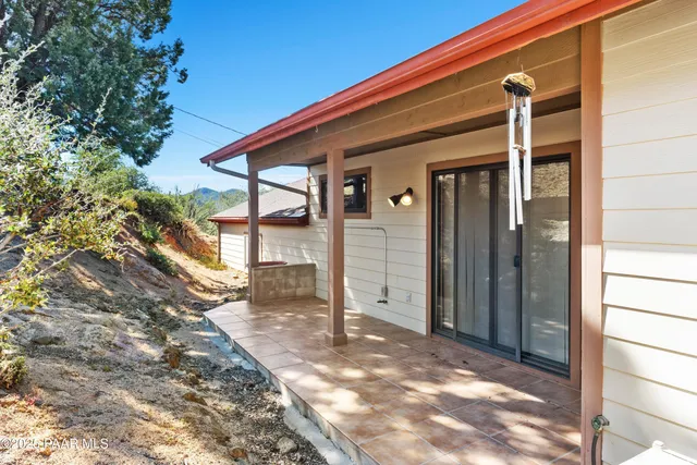 a view of house with backyard