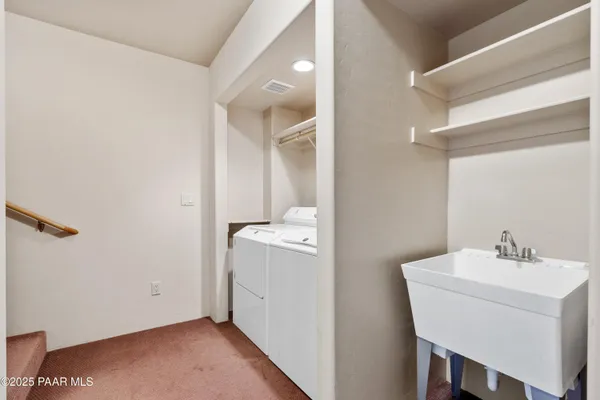 a bathroom with a sink and mirror