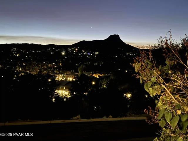 a view of sunset and a yard