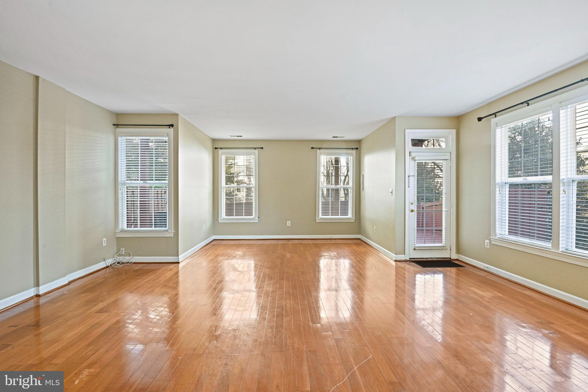 4150 Jeremy Grv Court Fairfax, VA 22030 - Photo 13 of 26 a view of an empty room with wooden floor and a window