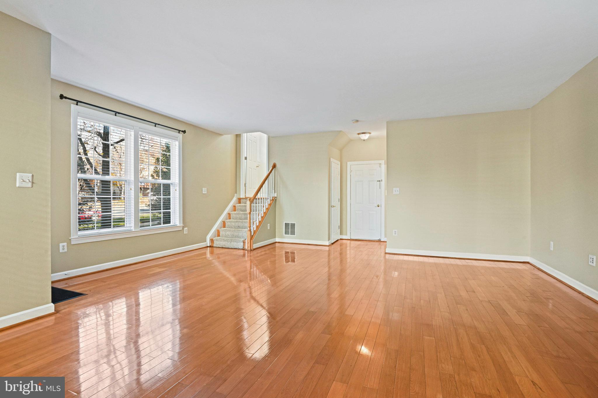4150 Jeremy Grv Court Fairfax, VA 22030 - Photo 15 of 26 a view of an empty room with wooden floor and a window