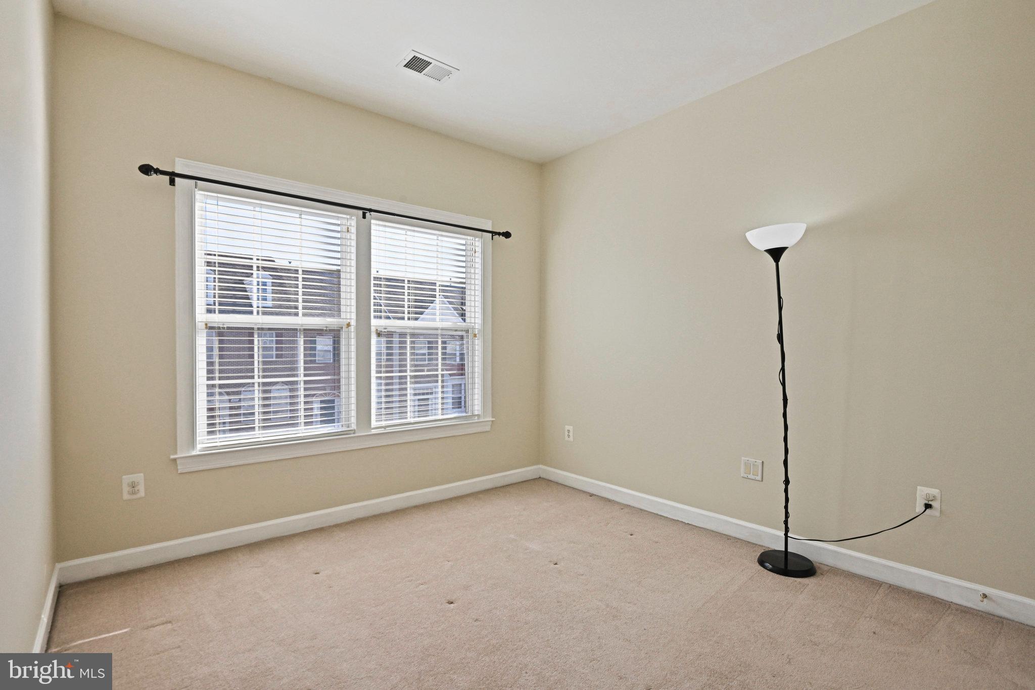 4150 Jeremy Grv Court Fairfax, VA 22030 - Photo 17 of 26 a view of an empty room with windows