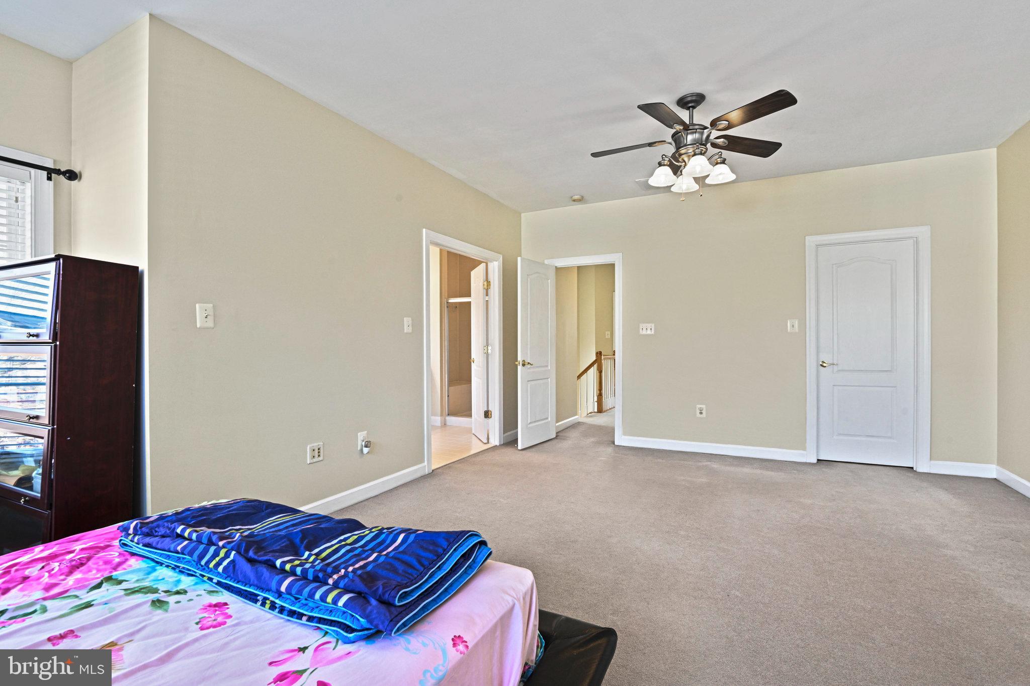4150 Jeremy Grv Court Fairfax, VA 22030 - Photo 19 of 26 a bedroom with a bed and a chandelier