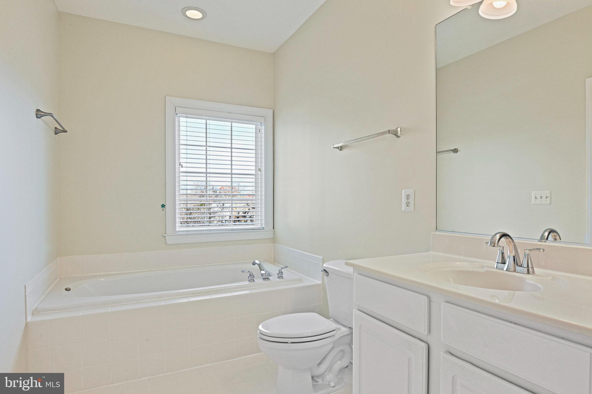 4150 Jeremy Grv Court Fairfax, VA 22030 - Photo 20 of 26 a bathroom with a sink a toilet and shower