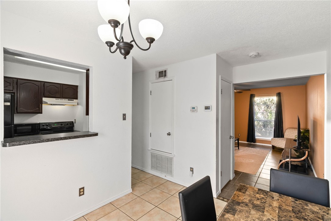 6702 Everhart Road, Unit H102 Corpus Christi, TX 78413 - Photo 5 of 15 a view of a livingroom with furniture and wooden floor