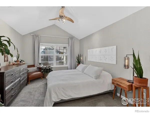 a bed room with a bed and a dresser
