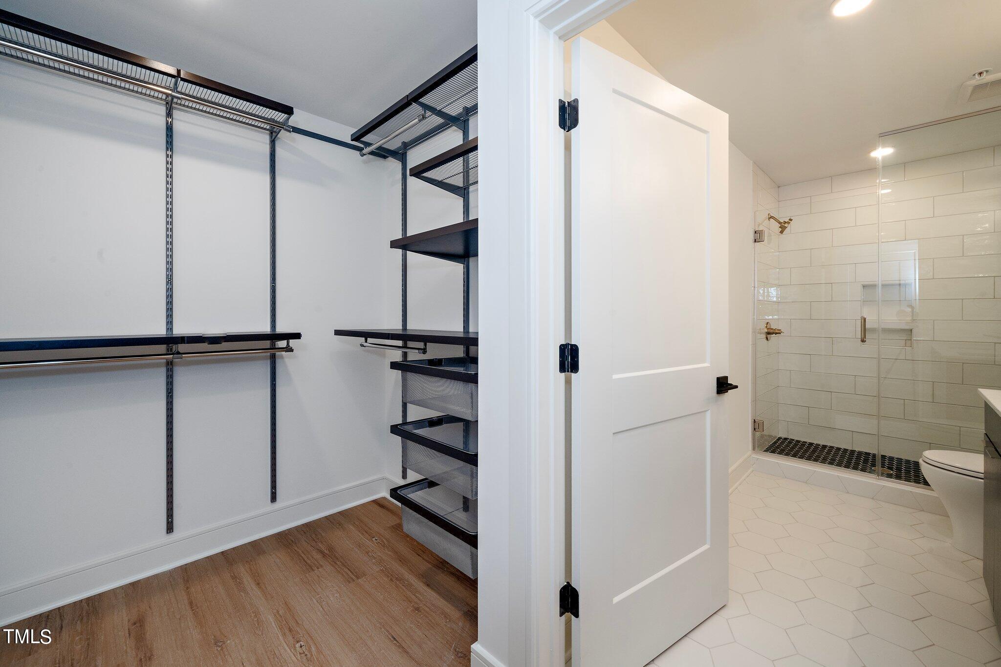 615 West Peace Street, Unit 306 Raleigh, NC 27603 - Photo 13 of 37 a view of empty room with wooden floor and fan