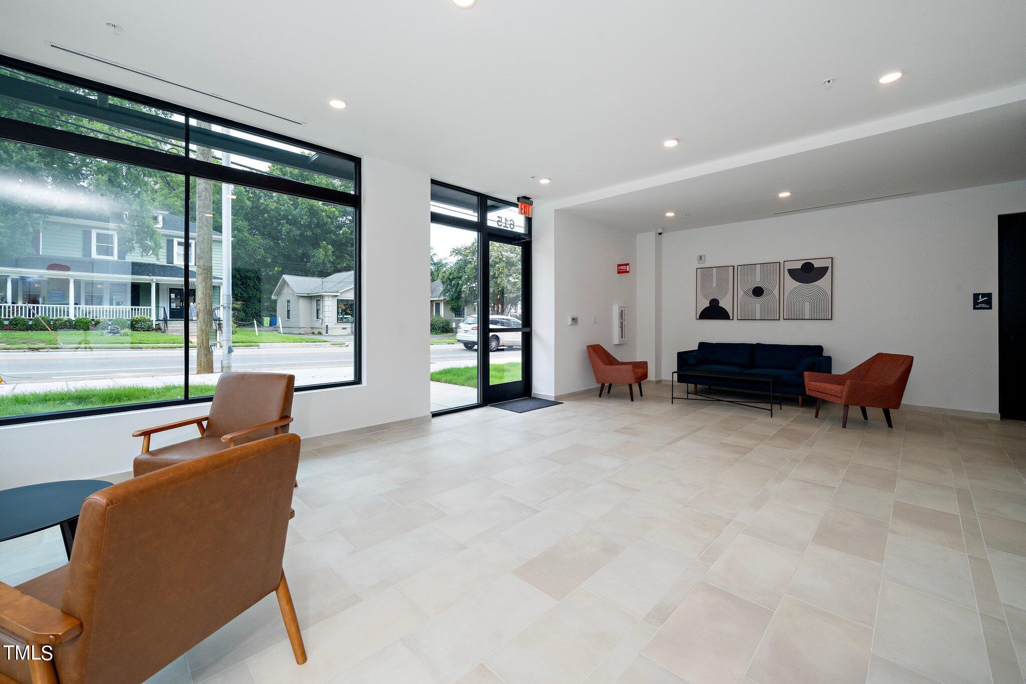 615 West Peace Street, Unit 306 Raleigh, NC 27603 - Photo 20 of 37 a living room with furniture and a large window