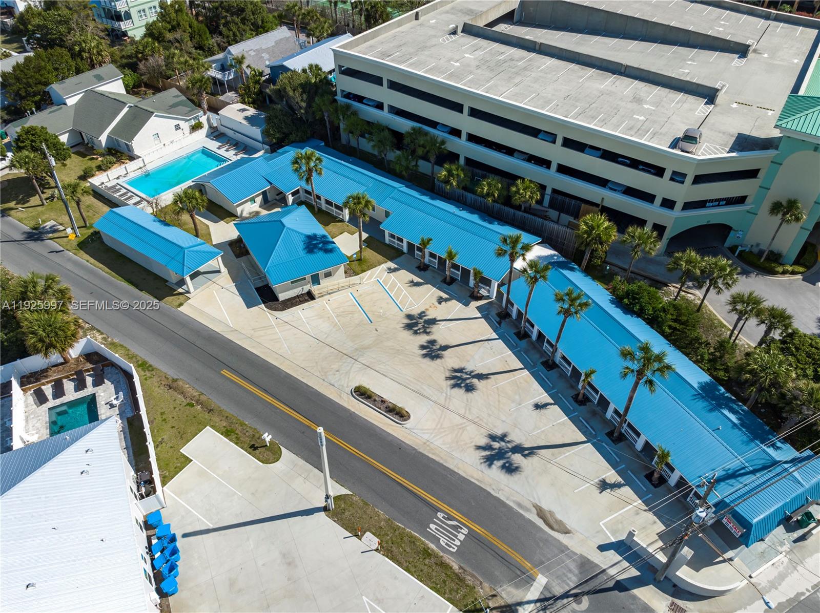17784 Front Beach Road, Unit 16 Panama City, FL 32413 - Photo 9 of 12 a view of swimming pool with outdoor seating