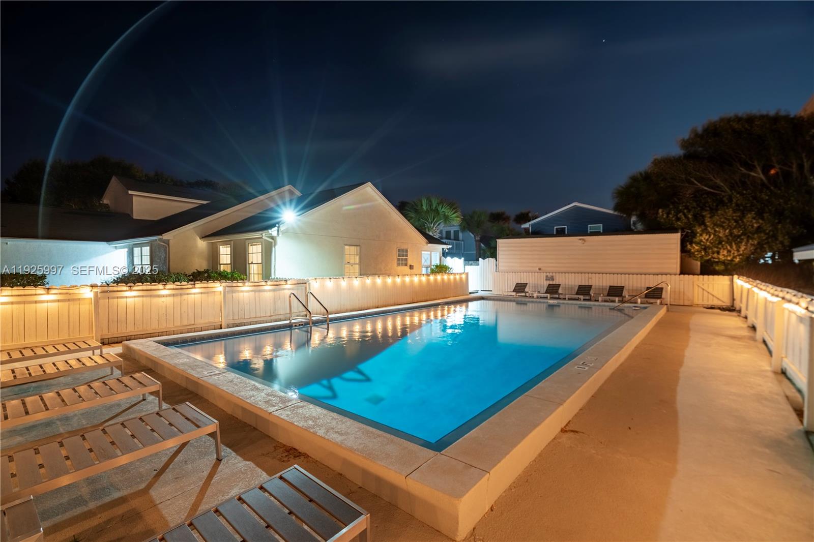 17784 Front Beach Road, Unit 16 Panama City, FL 32413 - Photo 10 of 12 a view of swimming pool with seating area