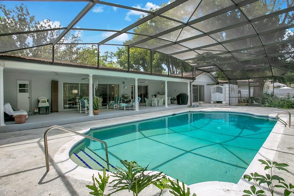 412 Forest Street Windermere, FL 34786 - Photo 18 of 34 a view of a swimming pool with a patio