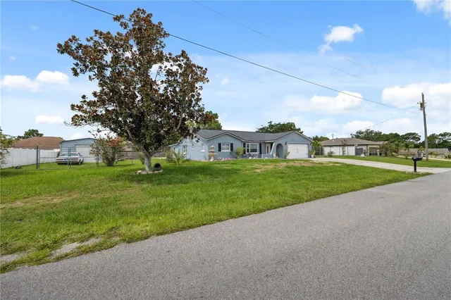 a view of a house with a big yard