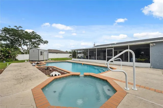 a view of a swimming pool with lounge chair