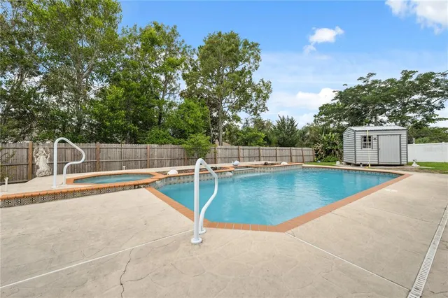 a view of a mini pool with a yard
