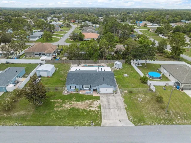 an aerial view of a house with a garden