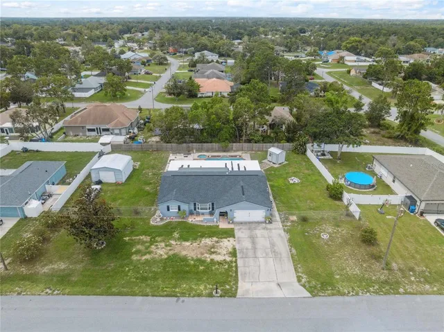 an aerial view of a house with a garden