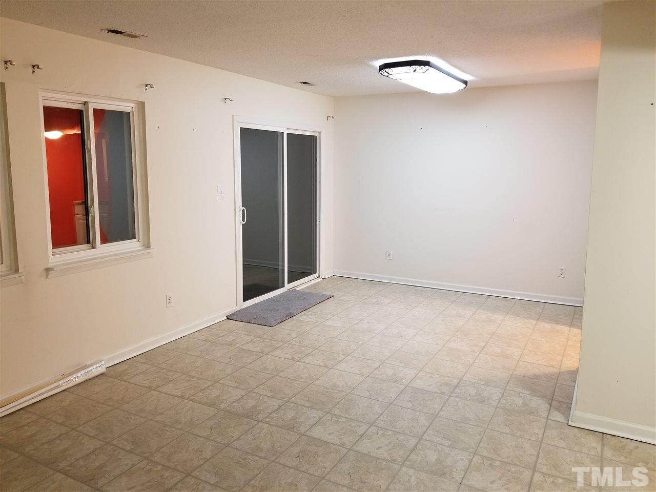 5911 Farm Gate Road Raleigh, NC 27606 - Photo 15 of 21 a view of an empty room with a window