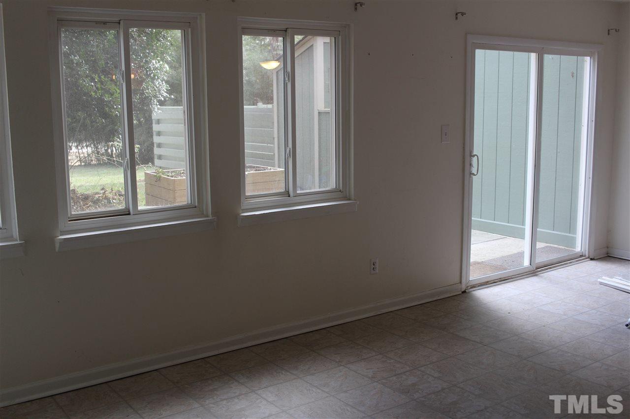 5911 Farm Gate Road Raleigh, NC 27606 - Photo 16 of 21 an empty room with windows and closet