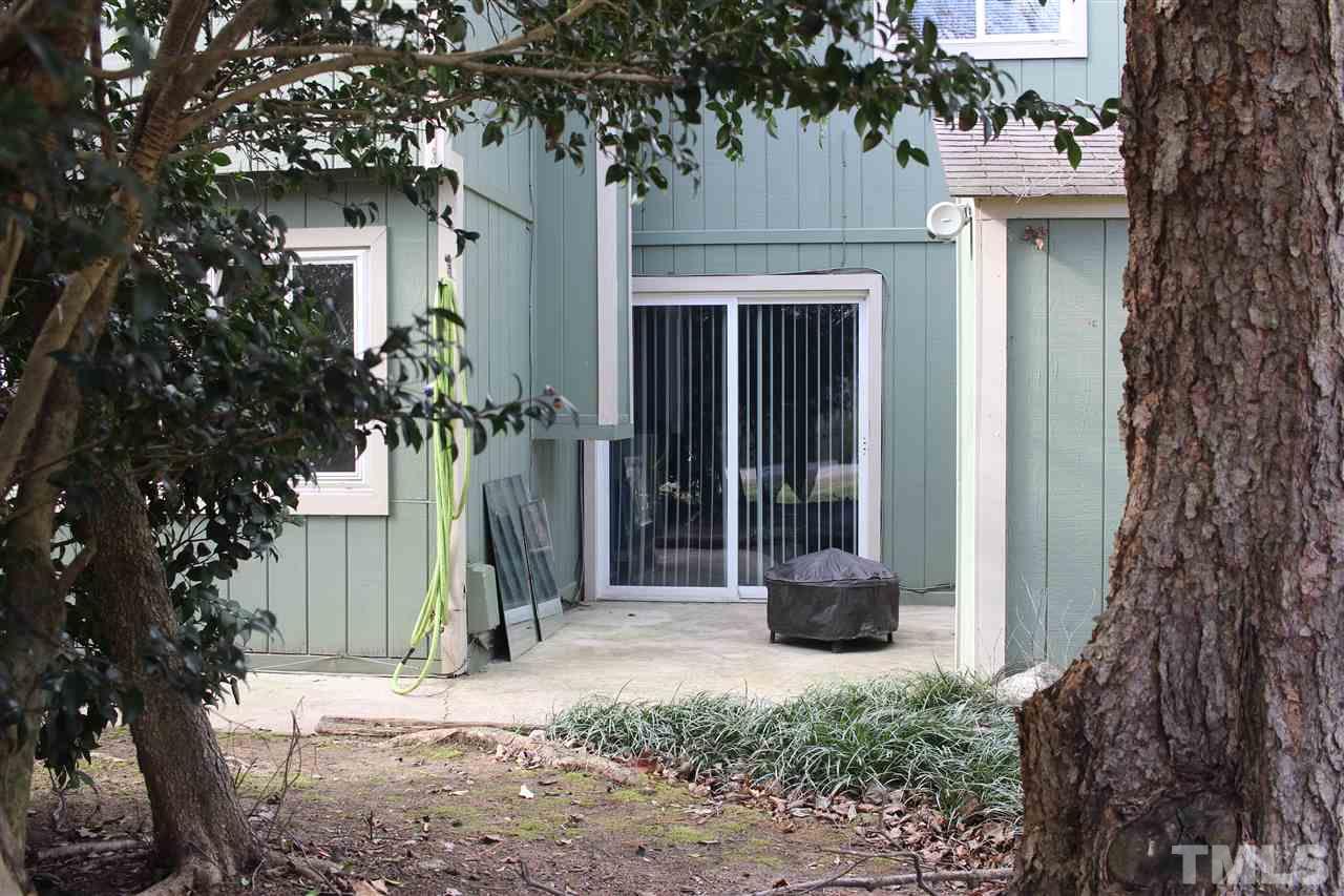 5911 Farm Gate Road Raleigh, NC 27606 - Photo 19 of 21 a front view of a house with a tree in front