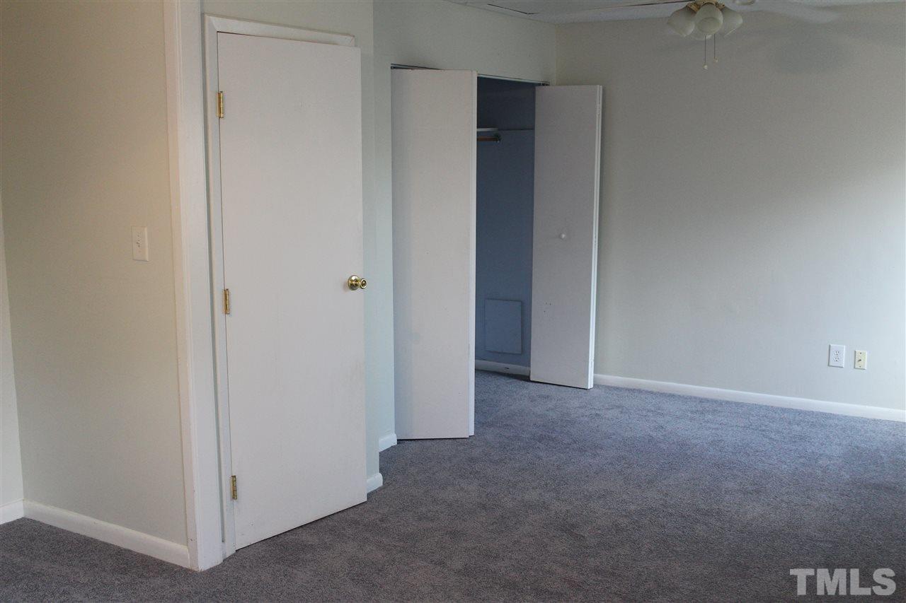 5911 Farm Gate Road Raleigh, NC 27606 - Photo 9 of 21 a view of an empty room and closet area