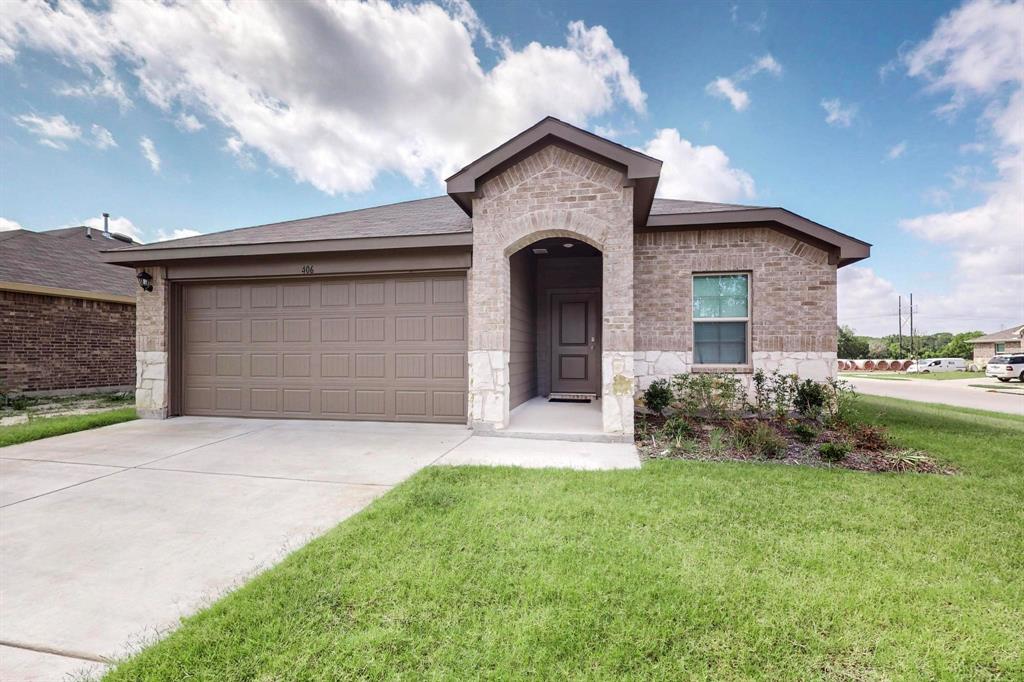 406 Regiment Road Sherman, TX 75090 - Photo 1 of 40 a front view of a house with garden