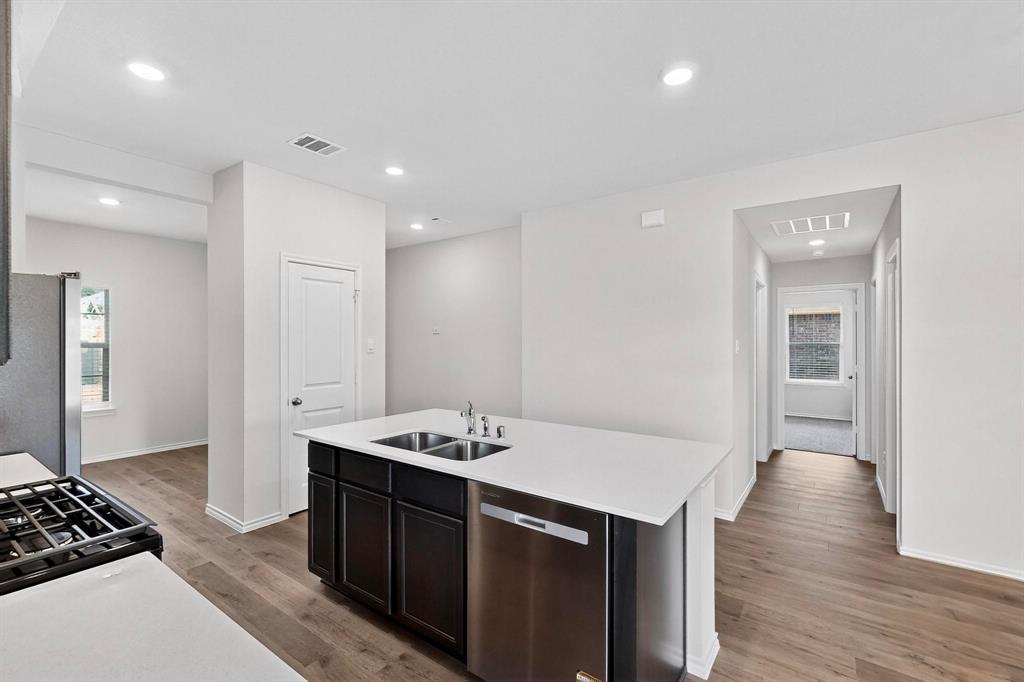 406 Regiment Road Sherman, TX 75090 - Photo 10 of 40 a kitchen with a sink and stove