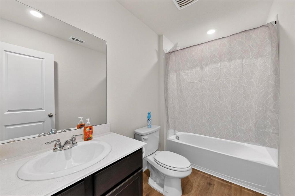 406 Regiment Road Sherman, TX 75090 - Photo 12 of 40 a bathroom with a sink toilet and shower