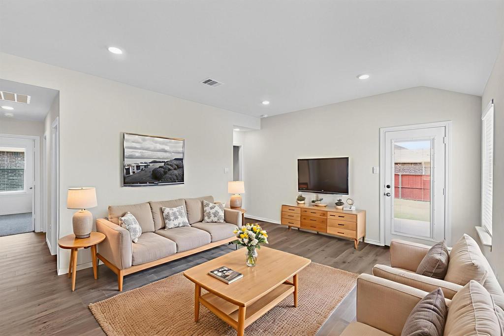 406 Regiment Road Sherman, TX 75090 - Photo 13 of 40 a living room with furniture and a flat screen tv