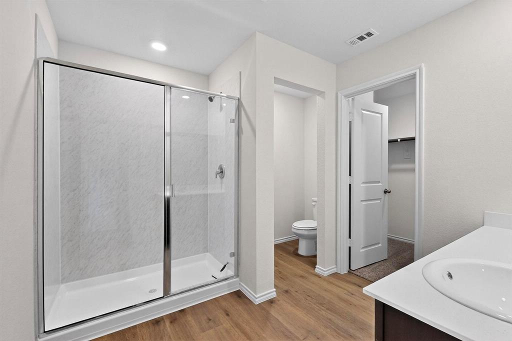 406 Regiment Road Sherman, TX 75090 - Photo 19 of 40 a bathroom with a shower and a sink