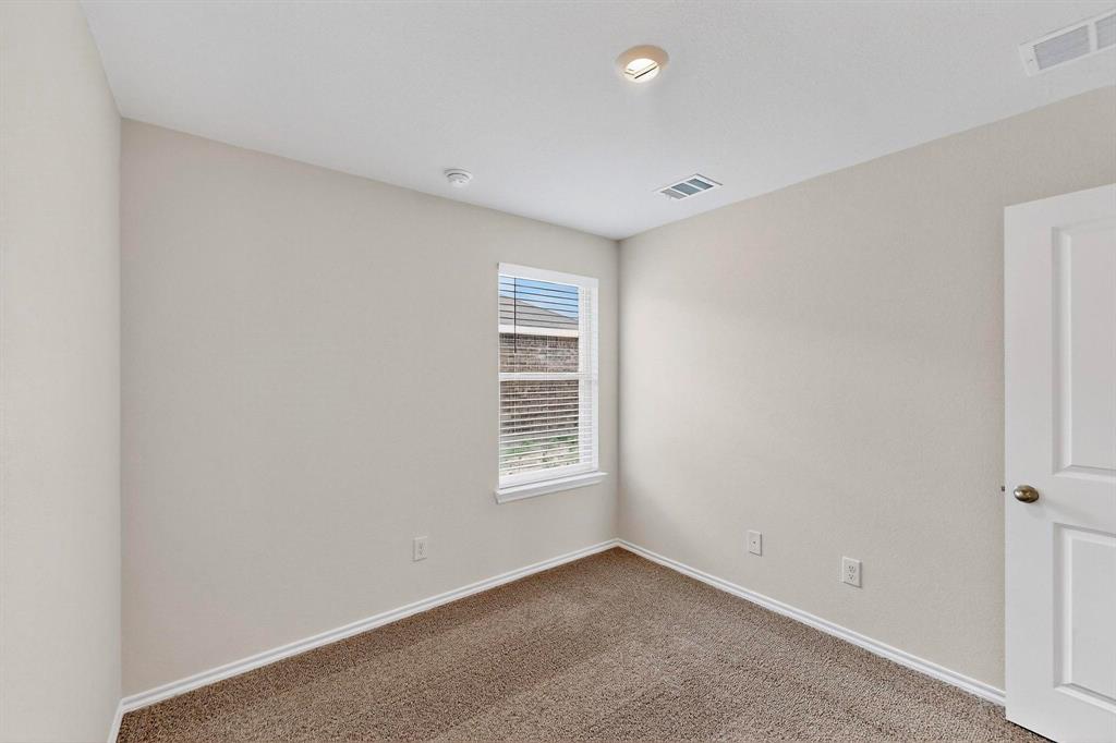 406 Regiment Road Sherman, TX 75090 - Photo 20 of 40 a view of an empty room with a window