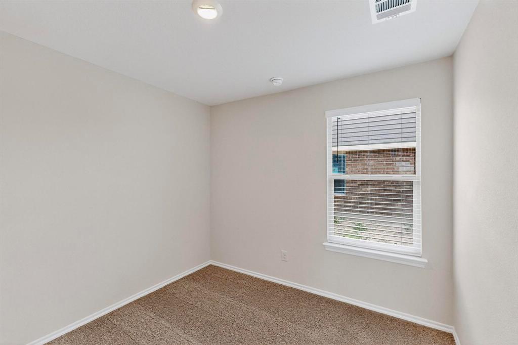 406 Regiment Road Sherman, TX 75090 - Photo 21 of 40 a view of an empty room with a window