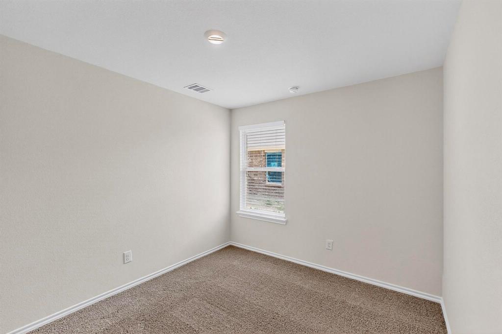 406 Regiment Road Sherman, TX 75090 - Photo 24 of 40 a view of an empty room with a window