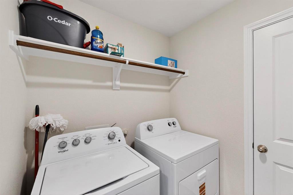 406 Regiment Road Sherman, TX 75090 - Photo 26 of 40 a utility room with dryer and washer