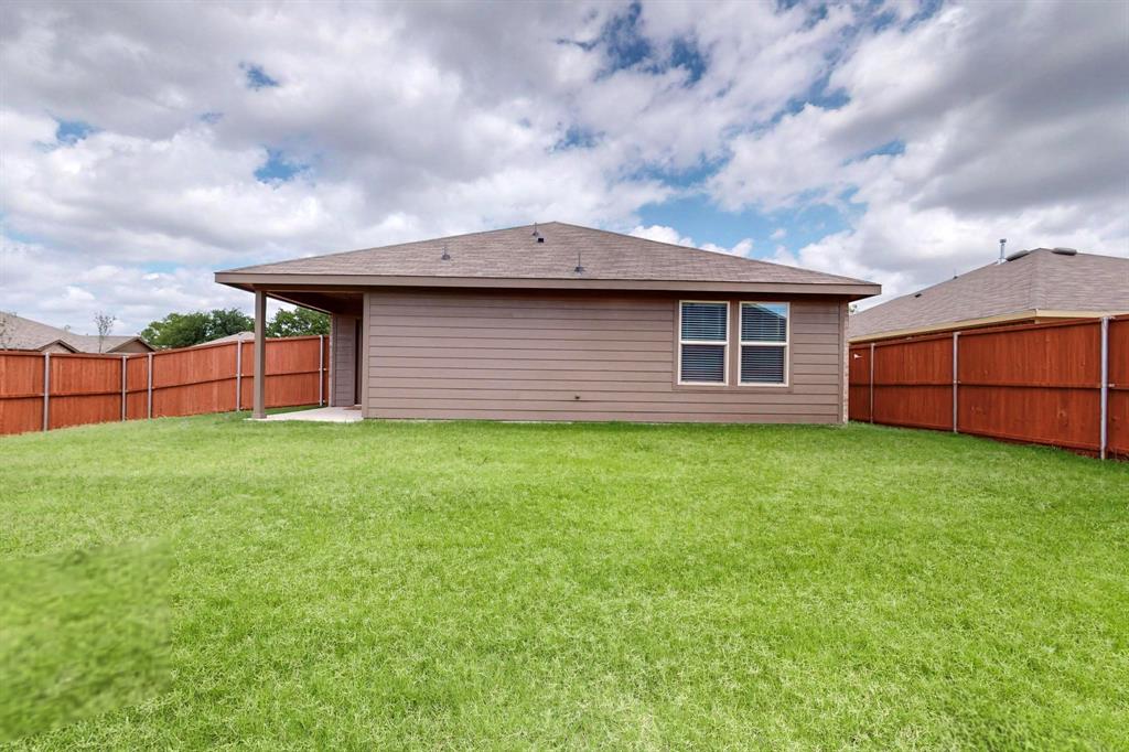 406 Regiment Road Sherman, TX 75090 - Photo 29 of 40 a backyard of a house with lots of green space