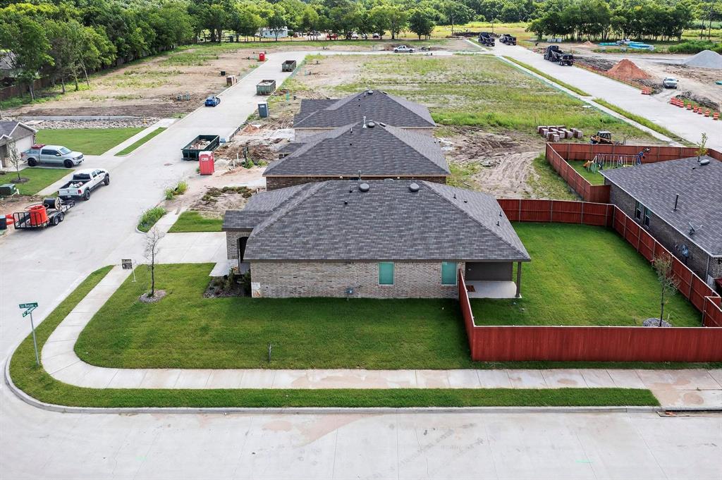 406 Regiment Road Sherman, TX 75090 - Photo 34 of 40 a view of a house with a yard