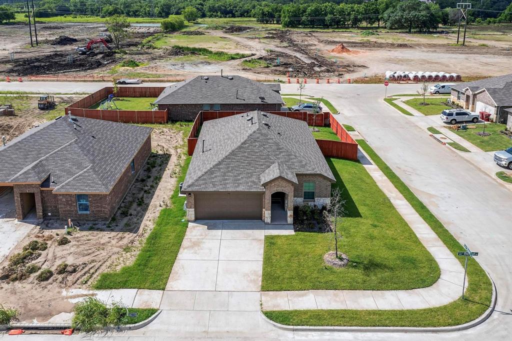 406 Regiment Road Sherman, TX 75090 - Photo 4 of 40 an aerial view of a house with a yard and lake view