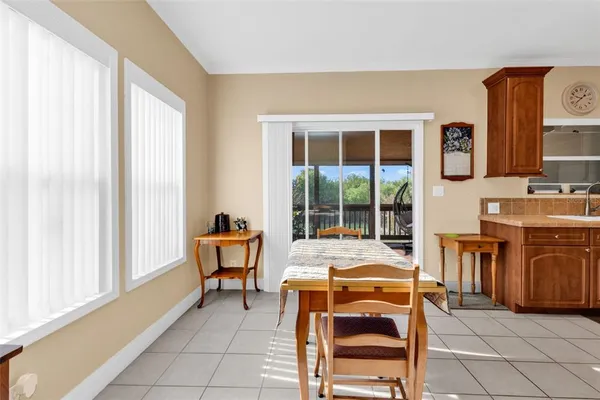 a view of a dining room with furniture and a window