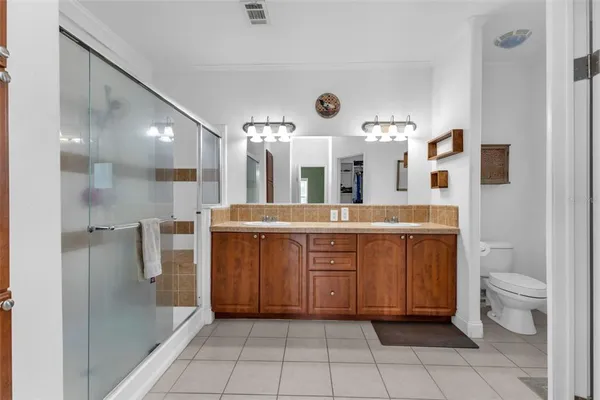 a bathroom with a sink vanity and mirror